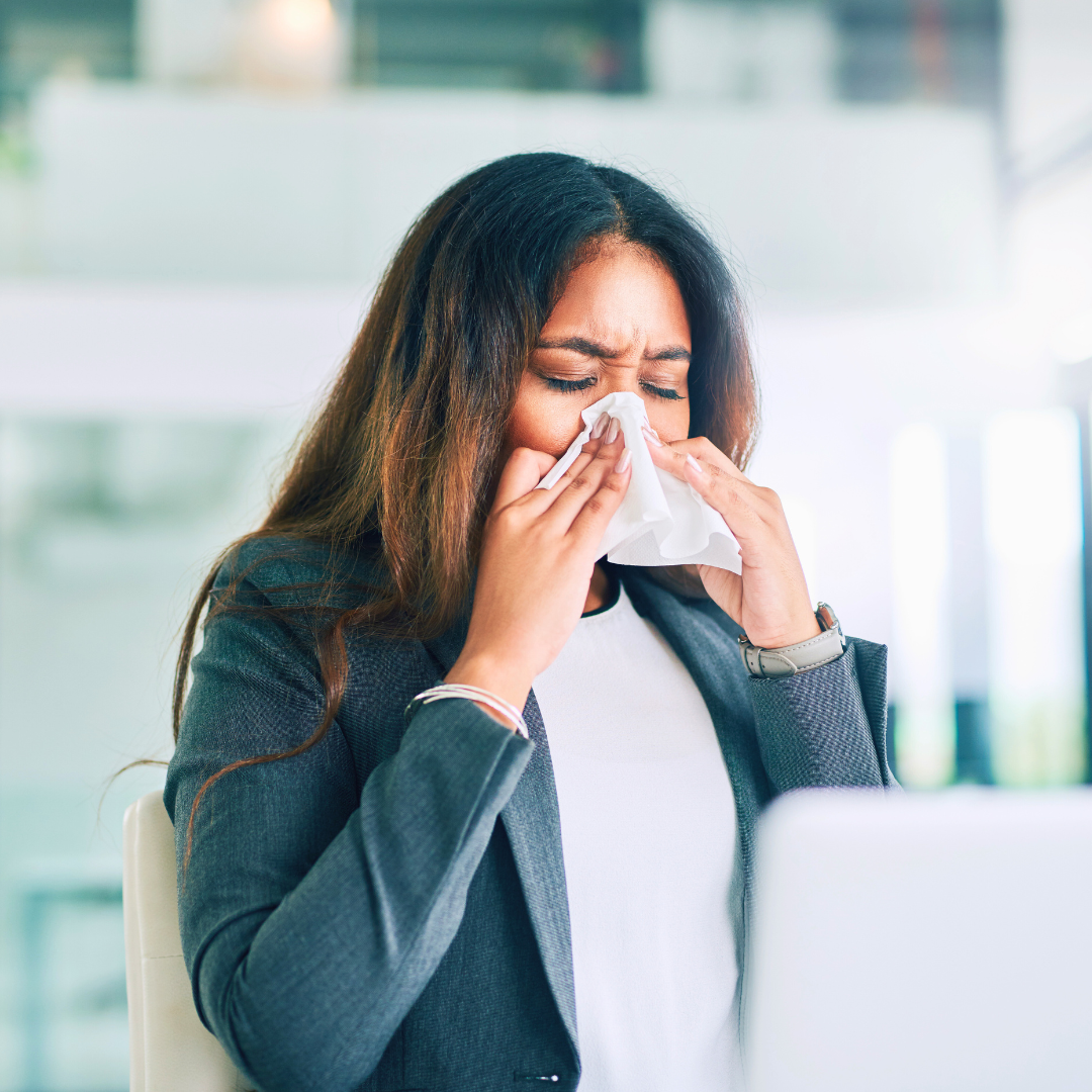 woman sneezing