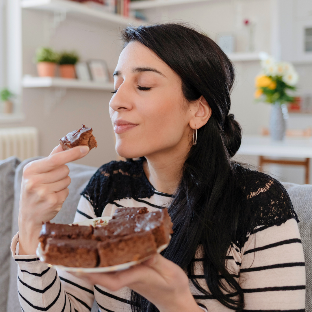 woman eating chocolate brownies
