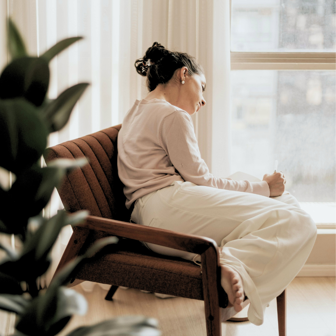 Woman experiencing fatigue and emotional stress related to hormone imbalance symptoms.